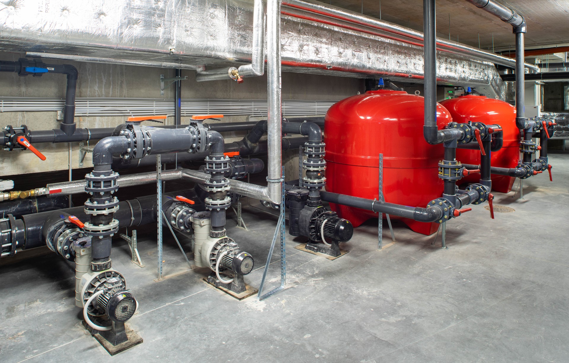 Boiler room. Heating system. Large boiler units. Metal piping system.